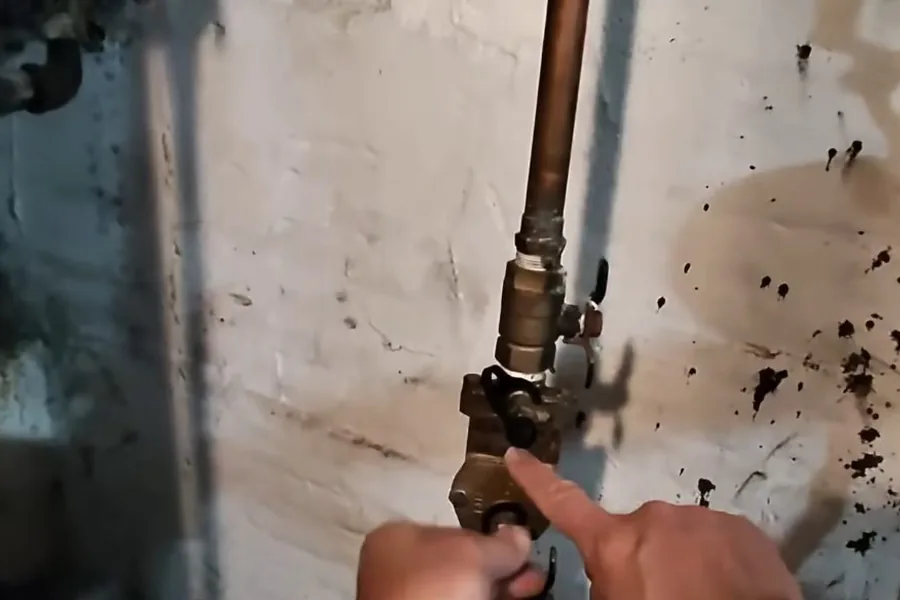 Technician testing a backflow prevention assembly for Backflow Testing in Fountain Valley, CA in Fountain Valley near the service area.